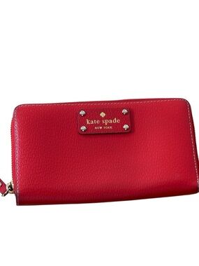 kate spade red zip-around leather wallet with gold logo plaque